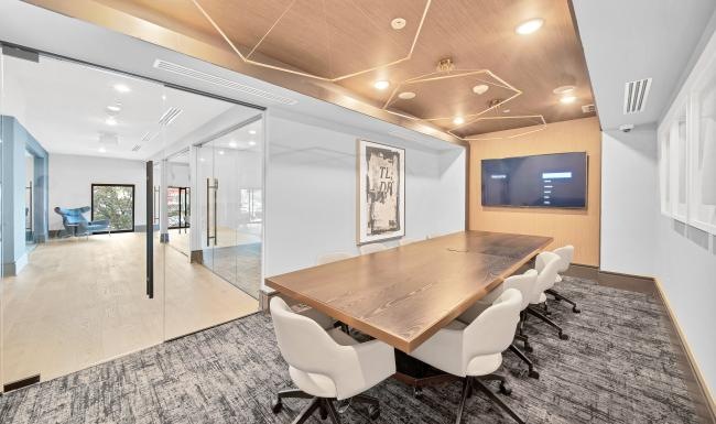 Settle into comfort at Bowen River Oaks a room with a table and chairs